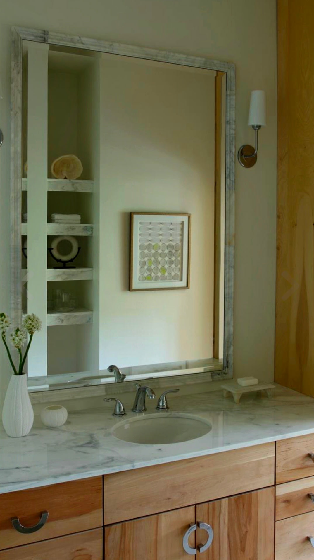 Bathroom vanity with a marble-framed mirror and white limestone vessels — Forest Hills, Nashville