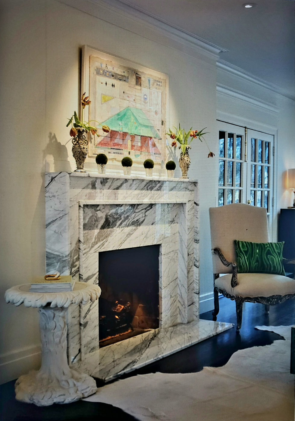 Sitting room with a marble fireplace mantel, gilt vases, and a Louis XV chair — Belle Meade, Nashville